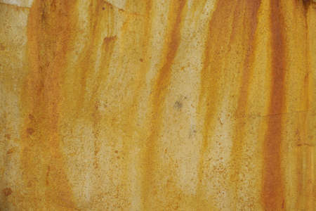 Texture of old rusty metal and yellow paint.の写真素材
