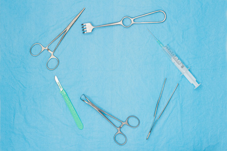 Surgical tools on a medical nonwoven fabric cloth. Surgical background with copy spaceの写真素材