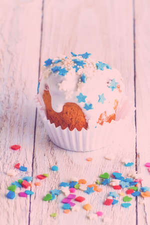 Sweet cake for holidays on a wooden table. Toned imageの写真素材