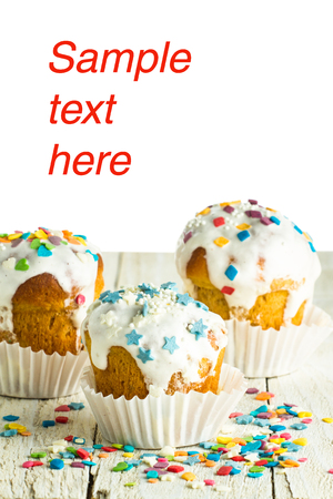 Tasty cakes for holidays on a wooden table isolated on a white backgroundの写真素材