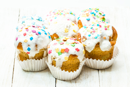 Tasty cakes on a white wooden backgroundの写真素材