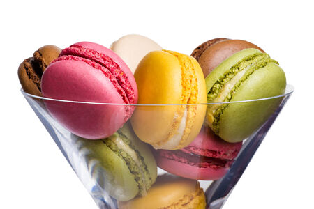 Colorful macaroons in a glass vase  isolated on a white backgroundの写真素材