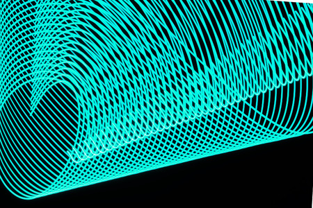 Abstract curved lines made of light painting or freezelight.