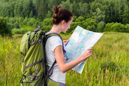 Woman reading map on hiking tripの写真素材