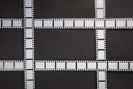 Film stripes on a black background with copy spaceの写真素材