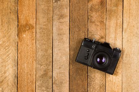 Old film camera on vintage background with copy spaceの写真素材