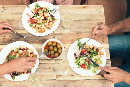 Overhead shot of young people having a lunch togetherの写真素材