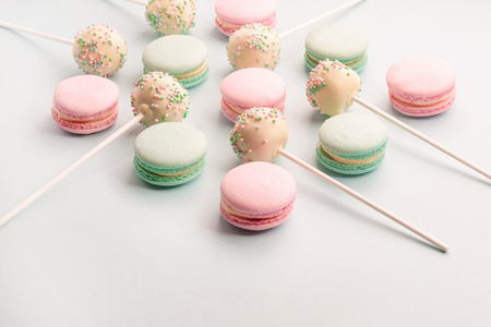 Sweet macarons and cake pops on sticks assortmentの写真素材