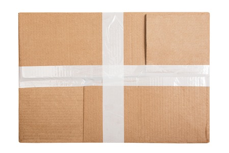 Cardboard box with white sticky tape isolated on white background. Top view. Flat layの写真素材