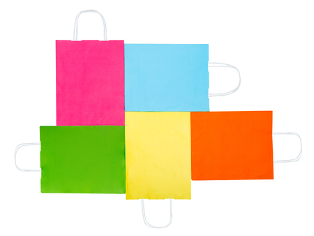 Colorful paper bags isolated on white background. Sale concept. Flat lay. Top viewの写真素材