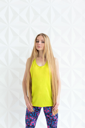 Portrait of sporty woman with long hair wearing sportswearの写真素材