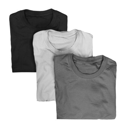 Collection of three folded t-shirts isolated on white background. Monochrome t-shirt conceptの写真素材