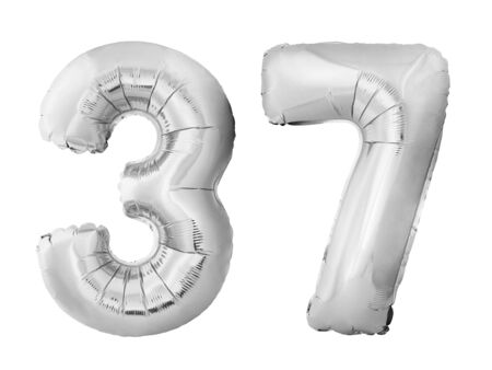 Number 37 thirty seven made of silver inflatable balloons isolated on white background. Chrome silver helium balloons forming 37 thirty seven. Birthday conceptの写真素材