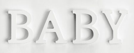 Word baby made of white letters on white backgroundの写真素材