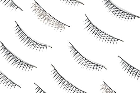 False eyelashes isolated on white background. Beautiful eyelash extensions. Flat layの写真素材