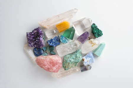 Crystals and gemstones on a w ite background. Flat lay of colorful gemstones and crystals.の写真素材