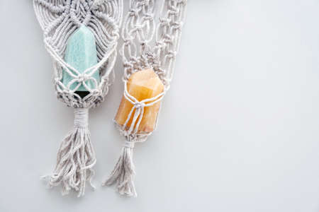 Pendants hippie macrame with gemstones as spiritual talismans on a white background with blank...