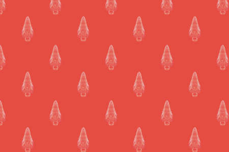 Abstract Christmas pattern background of abstract white Christmas trees on red backgroundの写真素材