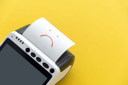 Online payment issue or error. Closeup of payment POS terminal with touchscreen green display with...