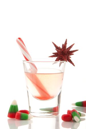 2011 Christmas drink with cane and cadies decorated with ornament on a white backgroundの写真素材
