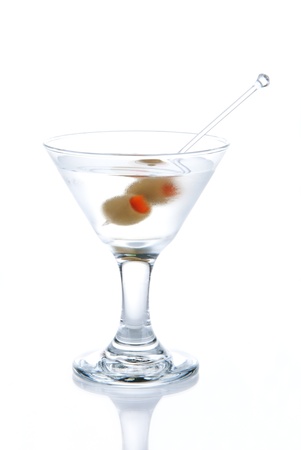 Classic Martini with olives filled by red papper inside isolated on a white backgroundの写真素材