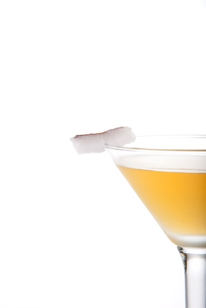 Azure martini cocktail with spiced rum, goldschlager, apple juice, lime and coconut slice isolated on a white backgroundの写真素材