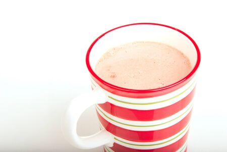 Red striped Christmas cup with with hot chocolate isolated on a white backgroundの写真素材