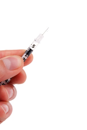 Professional doctor hand with medical syringe with insulin  in hand, ready for injection の写真素材