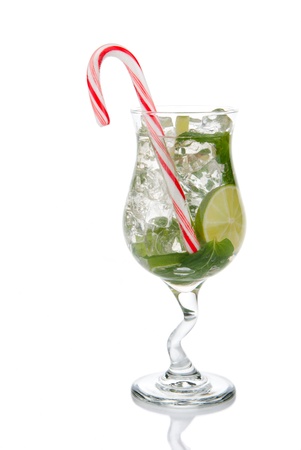 Mojito cocktail mint leaves, lime, simple sirup, light bacardi rum, club soda and christmas candy cane isolated on a white backgroundの写真素材