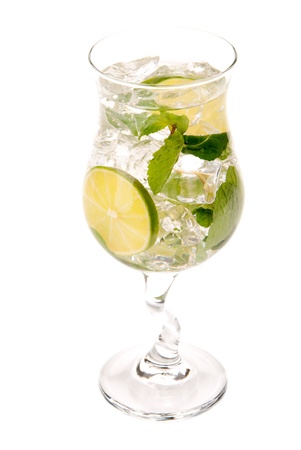 Classic Mojito summer drink with light rum, lime, spring of mint, simple soda and syrup in cocktail glass isolated on a white backgroundの写真素材