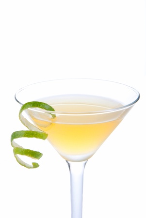Azure Martini cocktail witn spiced rum, apple juice, amaretto, vanilla vodka and lime spiral isolated on a white backgroundの写真素材