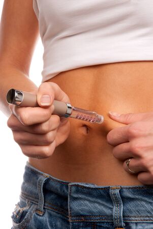 First type diabetes patient make a subcutaneous injection by single use syringe with needle and  long-acting lantus lispro insulin in abdomen by doctor prescription isolated on a white backgroundの写真素材