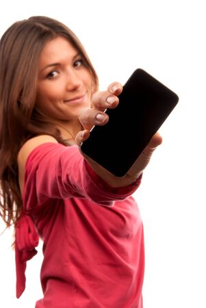 Young Pretty Woman Showing display of her new touch mobile cell phone. Focus on the hand and phone. の写真素材