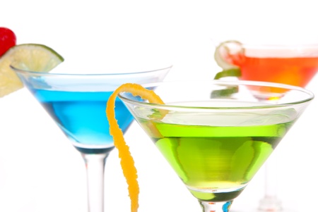 Tropical citrus martini Cocktails with vodka, light rum, gin, tequila, blue curacao, lime juice, lemonade, lemon slice, maraschino cherry isolated on a white backgroundの写真素材