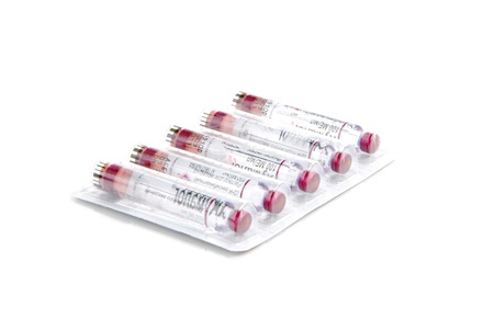 Diabetic insulin vials. Five new Cartridges for syringe-pen in a medicine box for diabetic patient on white background. Fast acting insulin analogueの写真素材