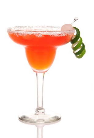 Red Margarita cocktail Strawberry or raspberry in chilled salt rimmed glass with tequila, juice, juice, orange syrup and crushed ice garnished with pearl onion, lime spiral on white backgroundの写真素材