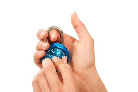 Blue locked Master Combination Dial time padlock lock in hand for security isolated on a white backgroundの写真素材