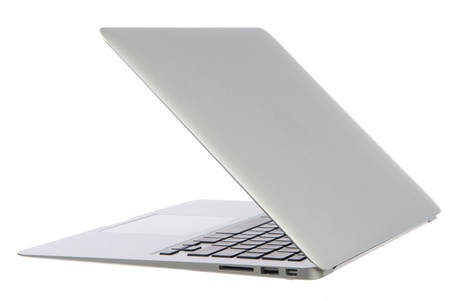 New high-speed thin silver aluminum laptop computer notebook side with touchpad, keyboard and open slots isolated on a white backgroundの写真素材