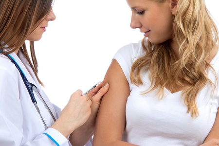Doctor making diabetes patient insulin flu shot by syringe with dose of humalog, subcutaneous arm injection vaccination isolated on a white background の写真素材