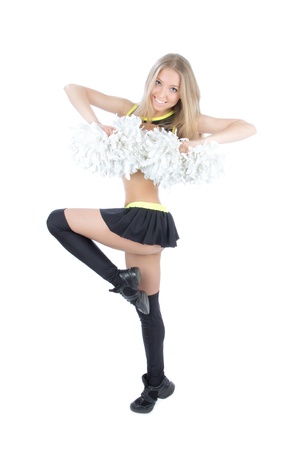 Beautiful cheerleader dancer girl from cheerleading team smiling isolated on a white background の写真素材