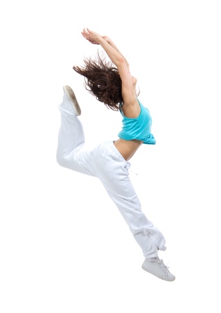 New pretty modern slim hip-hop style teenage girl jumping dancing isolated on a white studio backgroundの写真素材