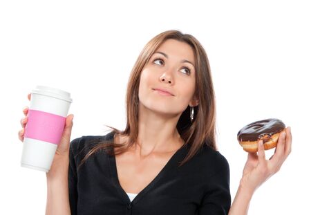 Woman holding donut and coffee in hand. Morning breakfast food concept isolated on a white backgroundの写真素材