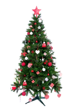 Decorated Christmas tree with patchwork ornament, artificial red star, hearts, hat and small presents for new year isolated on white backgroundの写真素材
