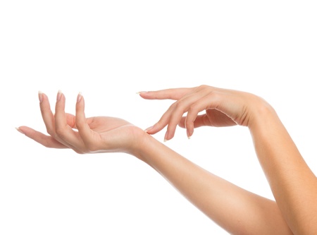 Beautiful woman hands with french manicure nails isolated on a white background