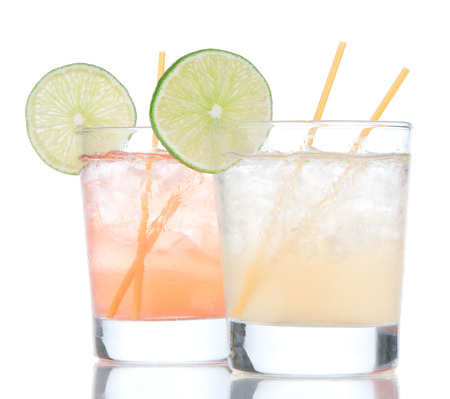 Summer beach margarita cocktails drink in spirit glasses isolated on a white backgroundの写真素材