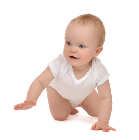 Infant child baby toddler sitting or crawling happy smiling on a white の写真素材