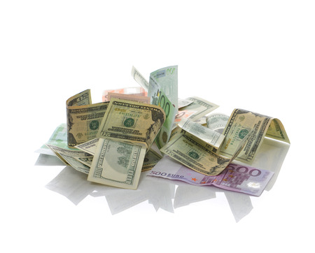 Heap of Dollar and euro Bills notes on white background with place for your textの写真素材