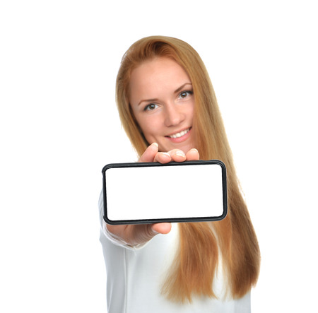 Business woman show blank card or mobile cell phone display on a white background. Focus on the handの写真素材