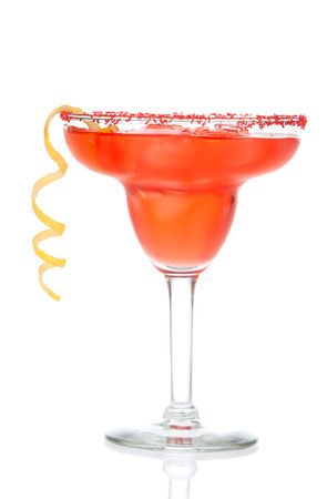 Red Strawberry or raspberry margarita cocktail in chilled salt rimmed glass with tequila orange syrup lemon spiral crushed ice in cocktails glass on white backgroundの写真素材