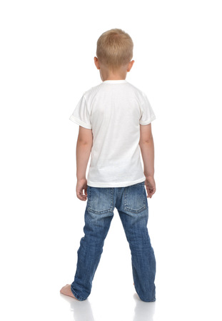 Rear view of caucasian full body american baby boy kid in tshirt and jeans standing isolated on a white backgroundの写真素材